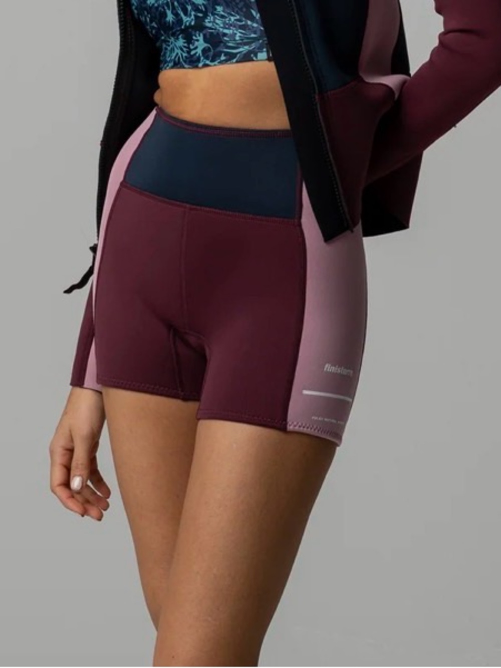Finisterre Women's Kaia 2mm Yulex® pants in Navy/Plum/Dark Orchid